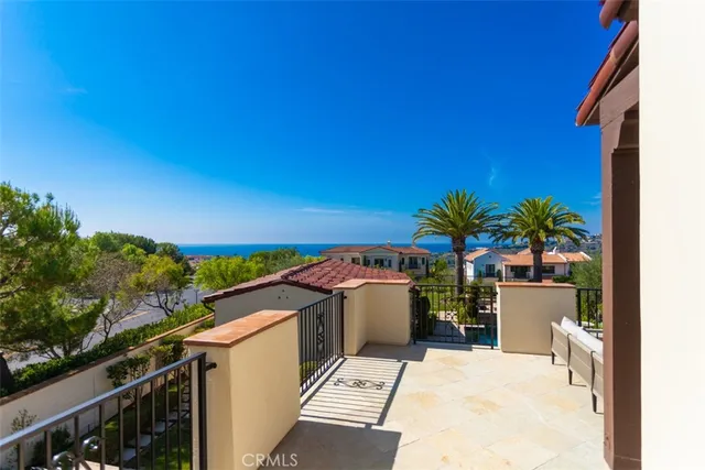a view of a house with yard and sitting area