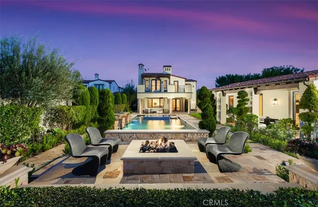 a view of a patio with table and chairs with wooden fence