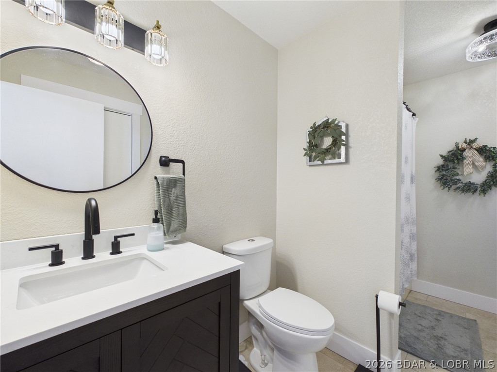 33433 Englewood Road Sunrise Beach, MO 65079 - Photo 16 of 54 Bathroom right off the living room