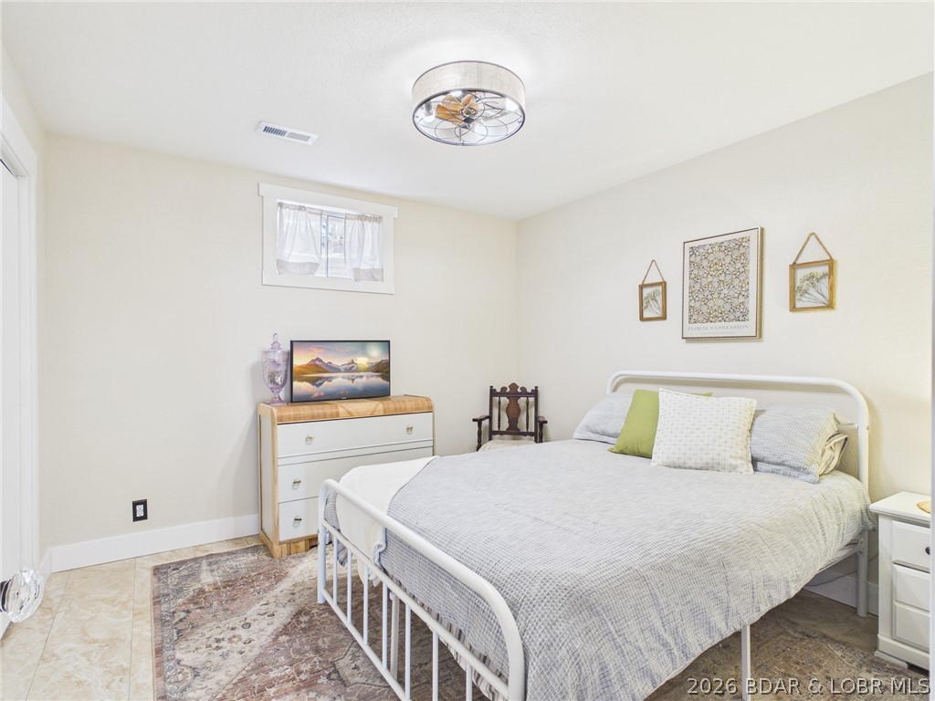 33433 Englewood Road Sunrise Beach, MO 65079 - Photo 19 of 54 1st bedroom off to the left of the hallway