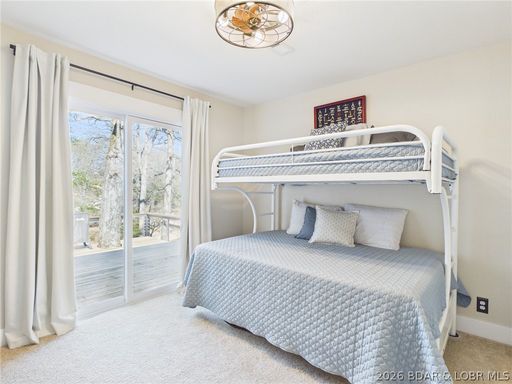 33433 Englewood Road Sunrise Beach, MO 65079 - Photo 21 of 54 2nd bedroom off to the right of the hallway