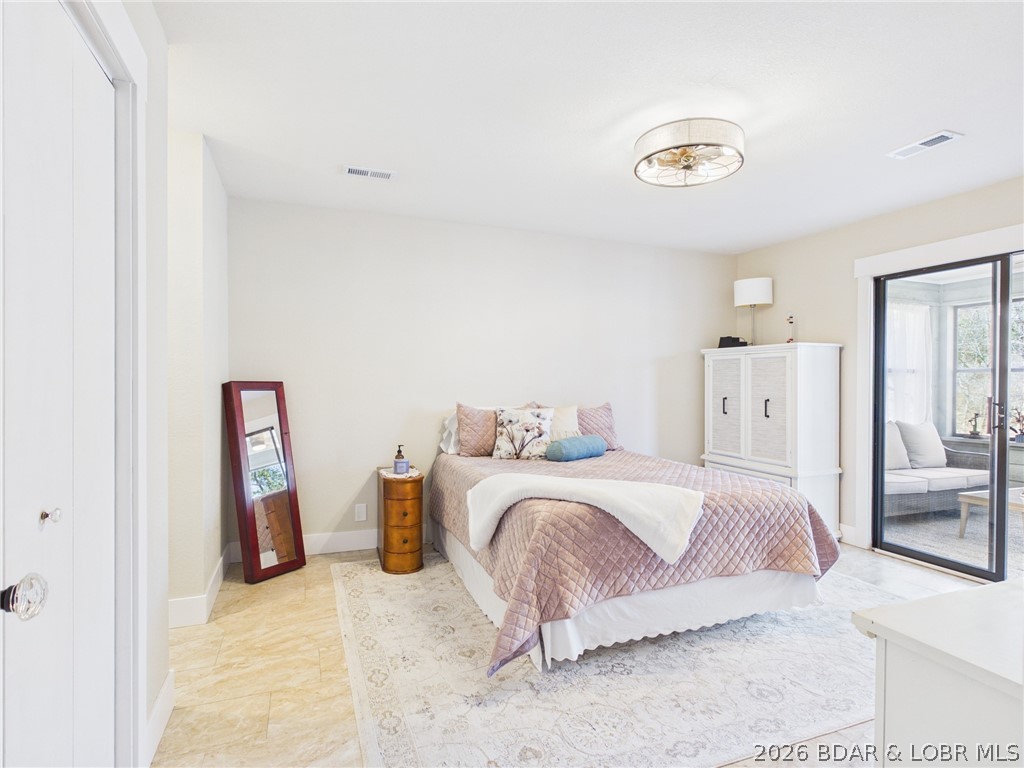 33433 Englewood Road Sunrise Beach, MO 65079 - Photo 23 of 54 Spacious master bedroom