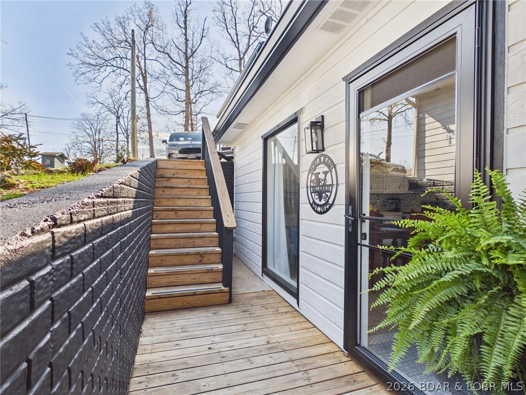 33433 Englewood Road Sunrise Beach, MO 65079 - Photo 33 of 54 Stairs to the road and garage