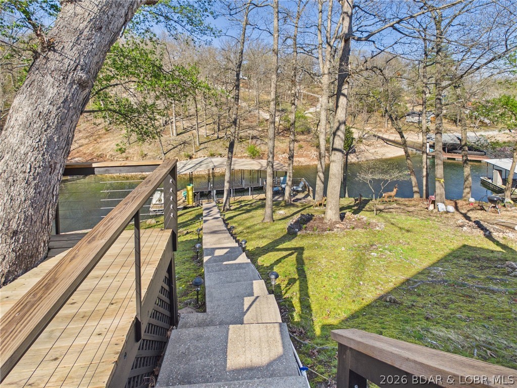 33433 Englewood Road Sunrise Beach, MO 65079 - Photo 38 of 54 Stairs to the dock and martini deck