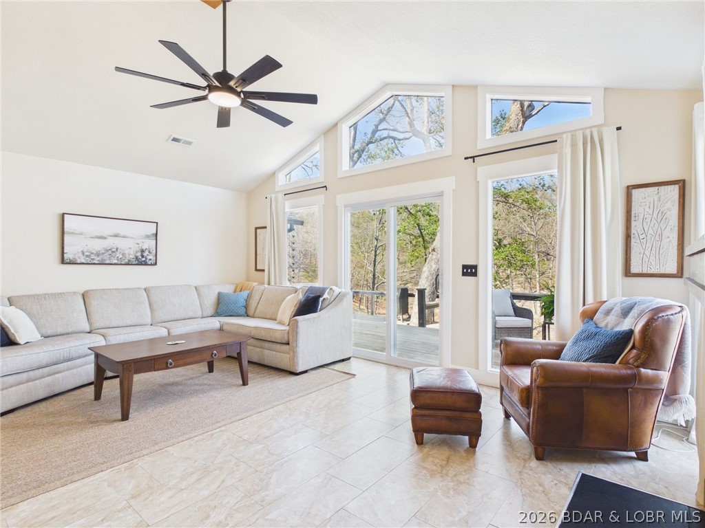 33433 Englewood Road Sunrise Beach, MO 65079 - Photo 4 of 54 Walking into the home with vaulted ceilings