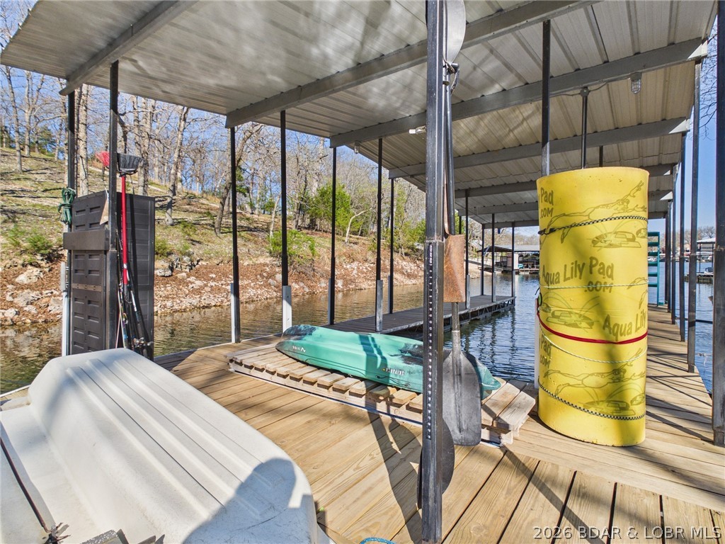 33433 Englewood Road Sunrise Beach, MO 65079 - Photo 47 of 54 Water mat, kayak, and paddle boat are waiting for