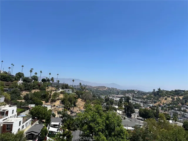 an aerial view of mountain with trees around