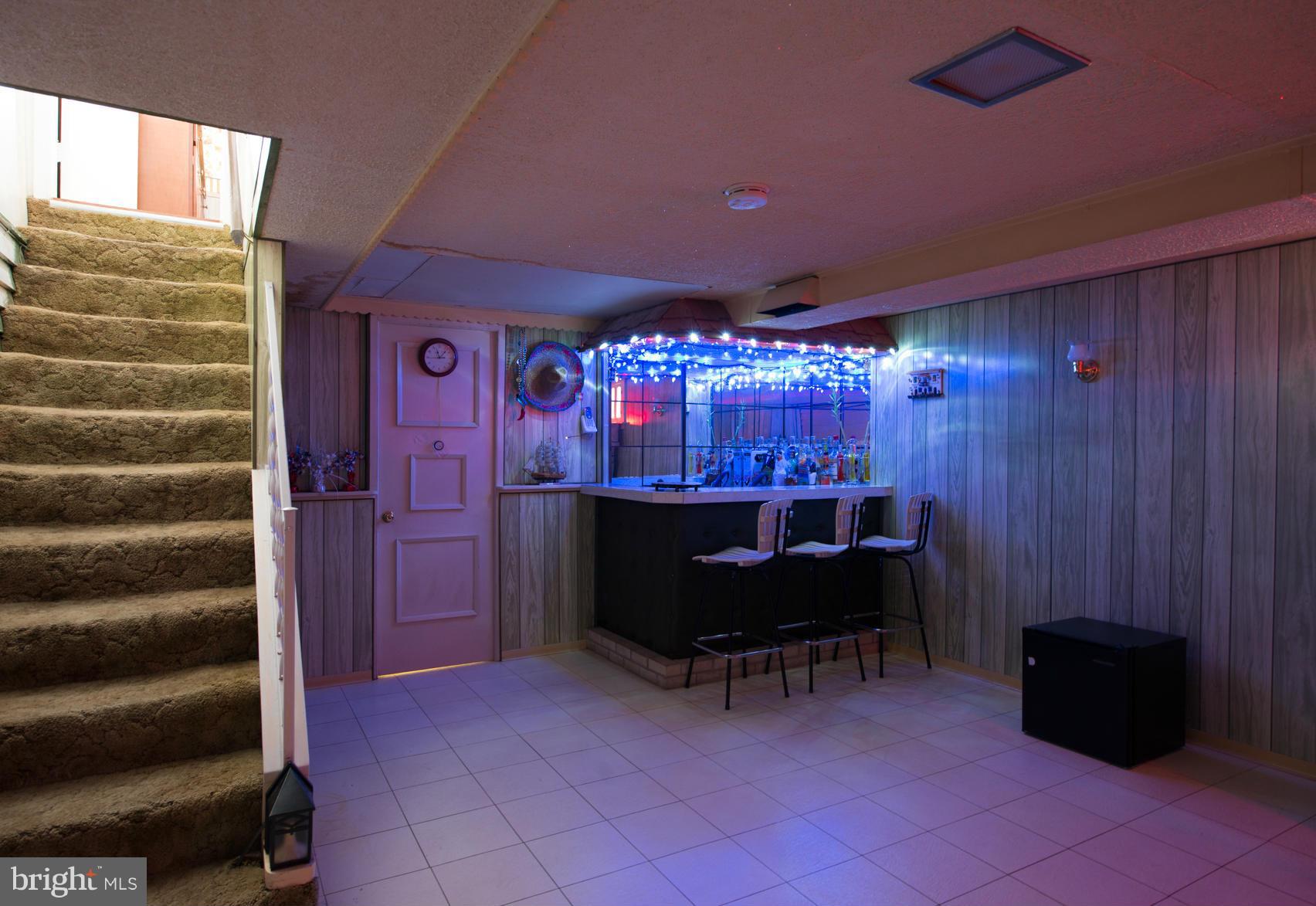 8331 Kavanagh Road Baltimore, MD 21222 - Photo 23 of 28 a room with furniture and a chandelier