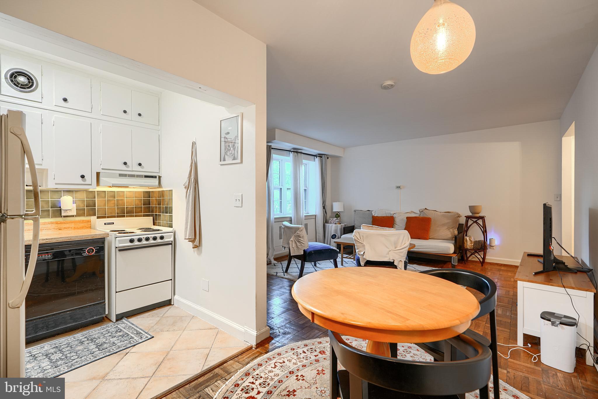3601 Greenway, Unit 303 Baltimore, MD 21218 - Photo 11 of 30 a room with stainless steel appliances kitchen island granite countertop a stove a refrigerator and a sink