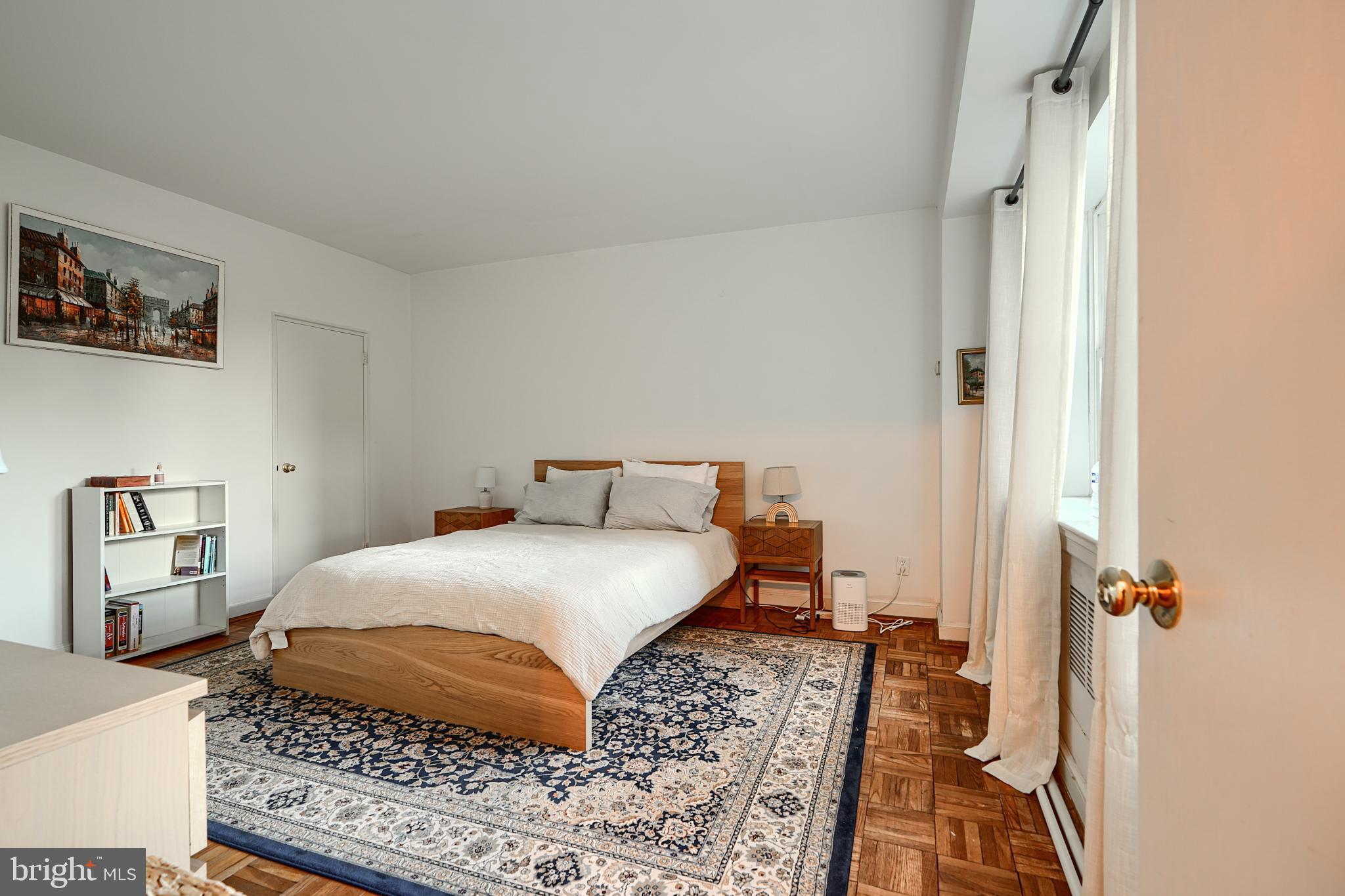 3601 Greenway, Unit 303 Baltimore, MD 21218 - Photo 15 of 30 a bedroom with a bed and a book shelf