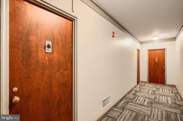 a view of a hallway with a bedroom