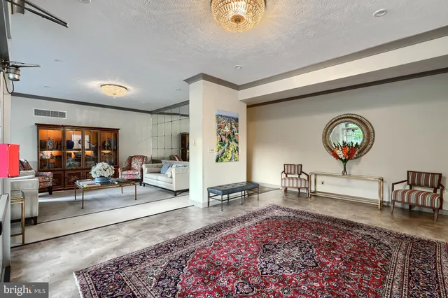 a living room with furniture and a table