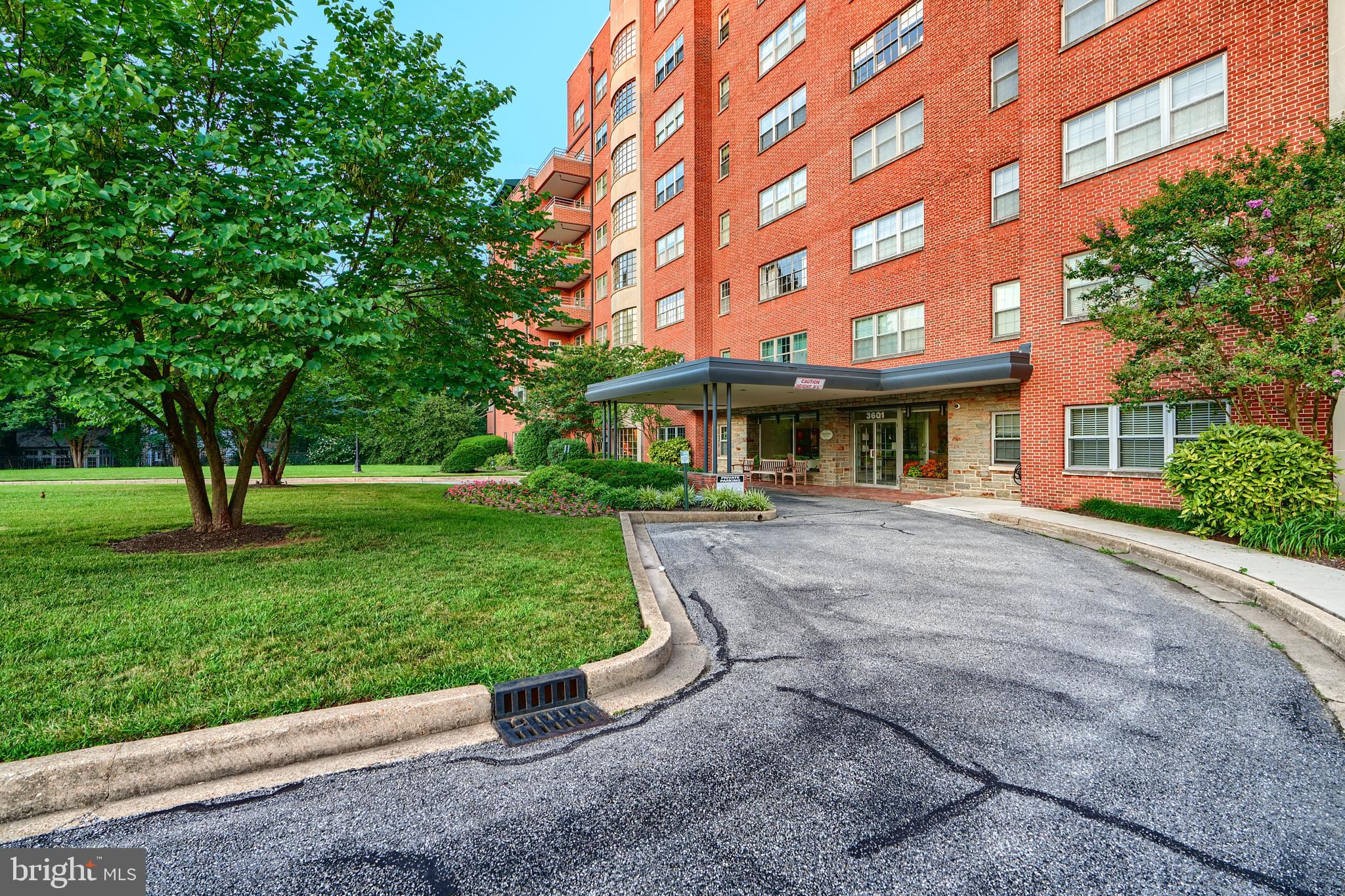 3601 Greenway, Unit 303 Baltimore, MD 21218 - Photo 29 of 30 front view of a brick building with a yard