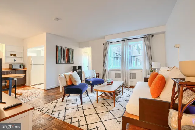 a living room with furniture and a window