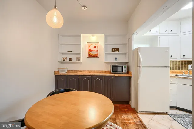 a kitchen with a refrigerator a stove and a refrigerator