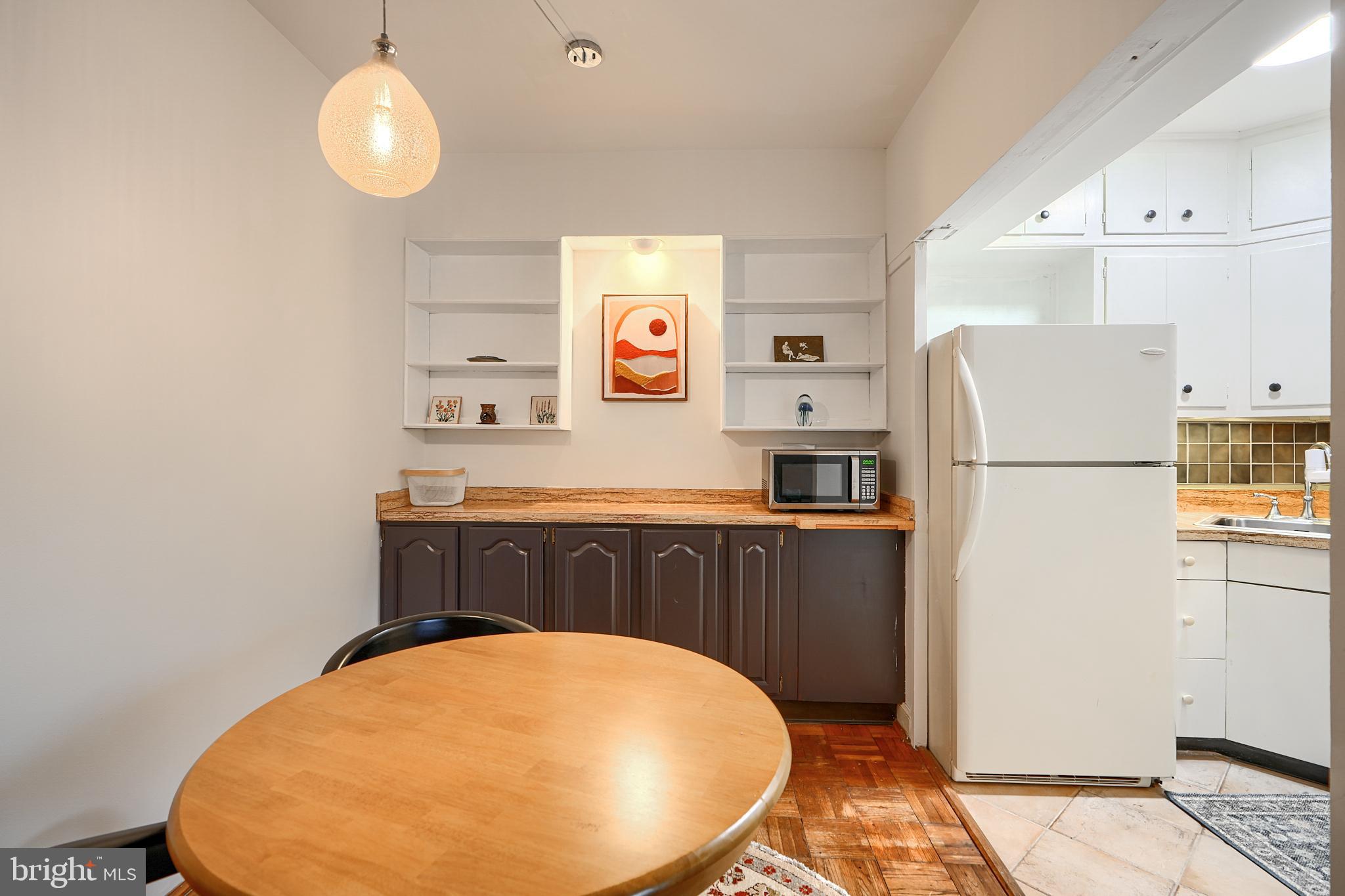 3601 Greenway, Unit 303 Baltimore, MD 21218 - Photo 10 of 30 a kitchen with a refrigerator a stove and a refrigerator