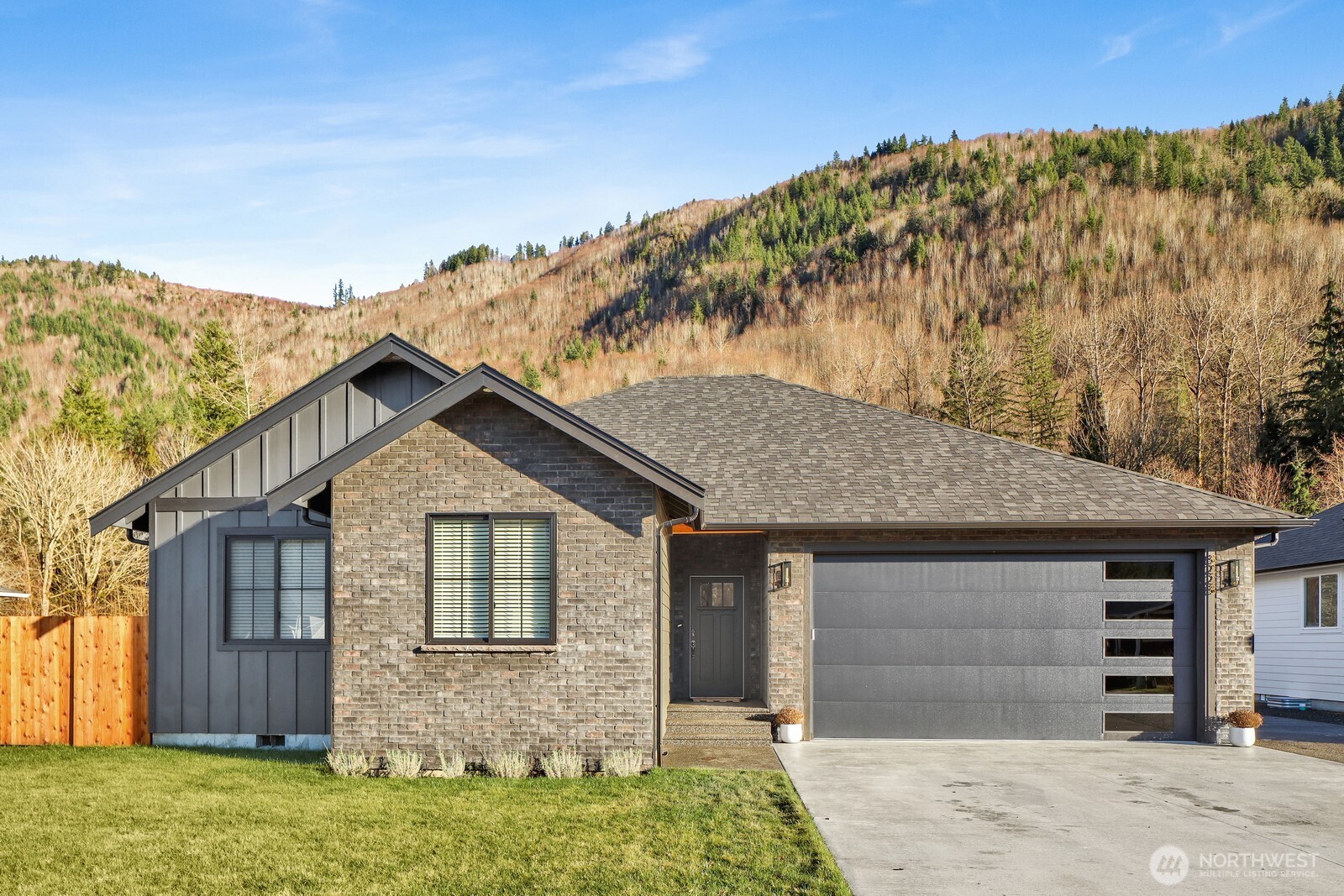 a front view of a house with a yard