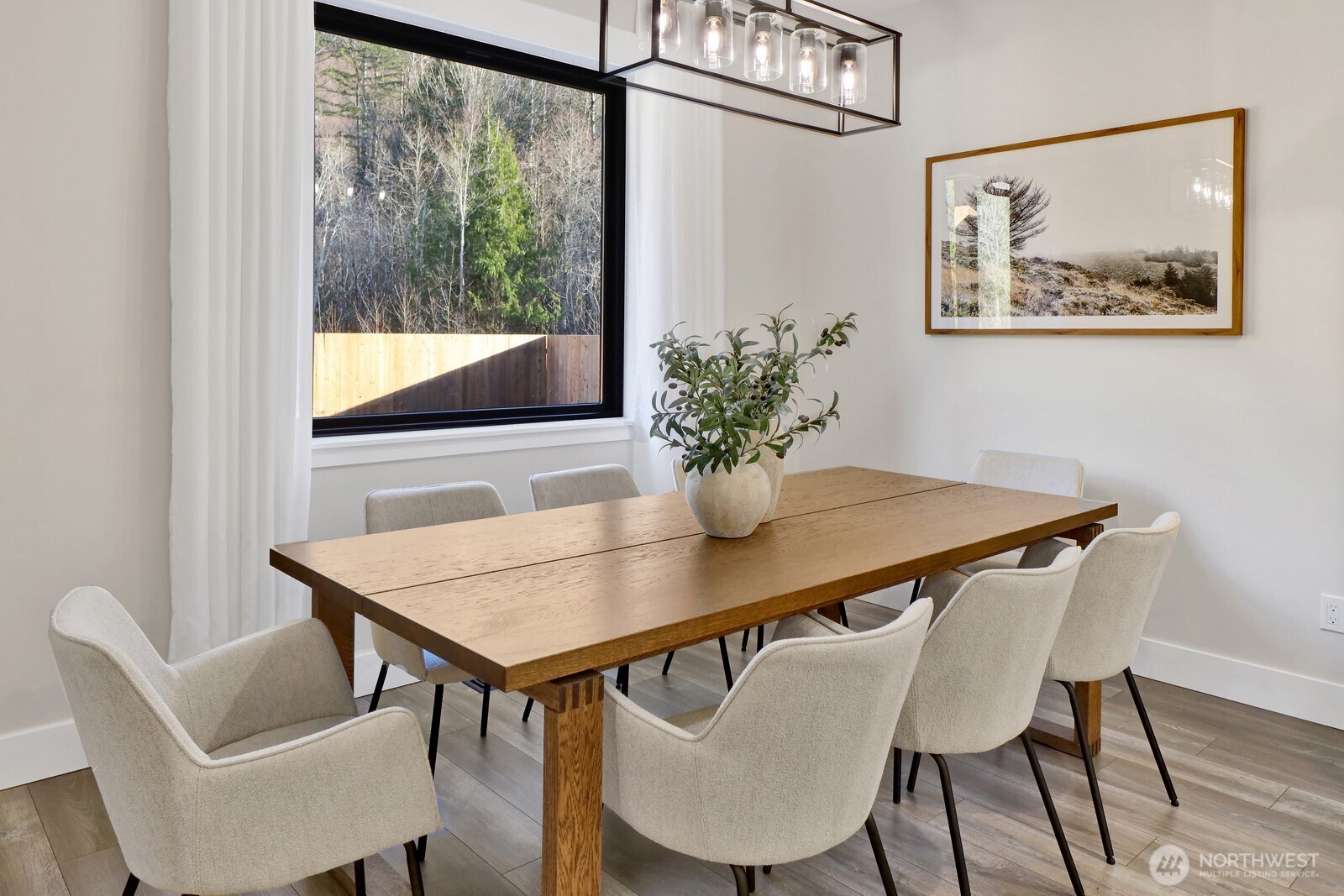 8228 Goldrun Drive Maple Falls, WA 98266 - Photo 15 of 33 a view of a dining room with furniture window and wooden floor
