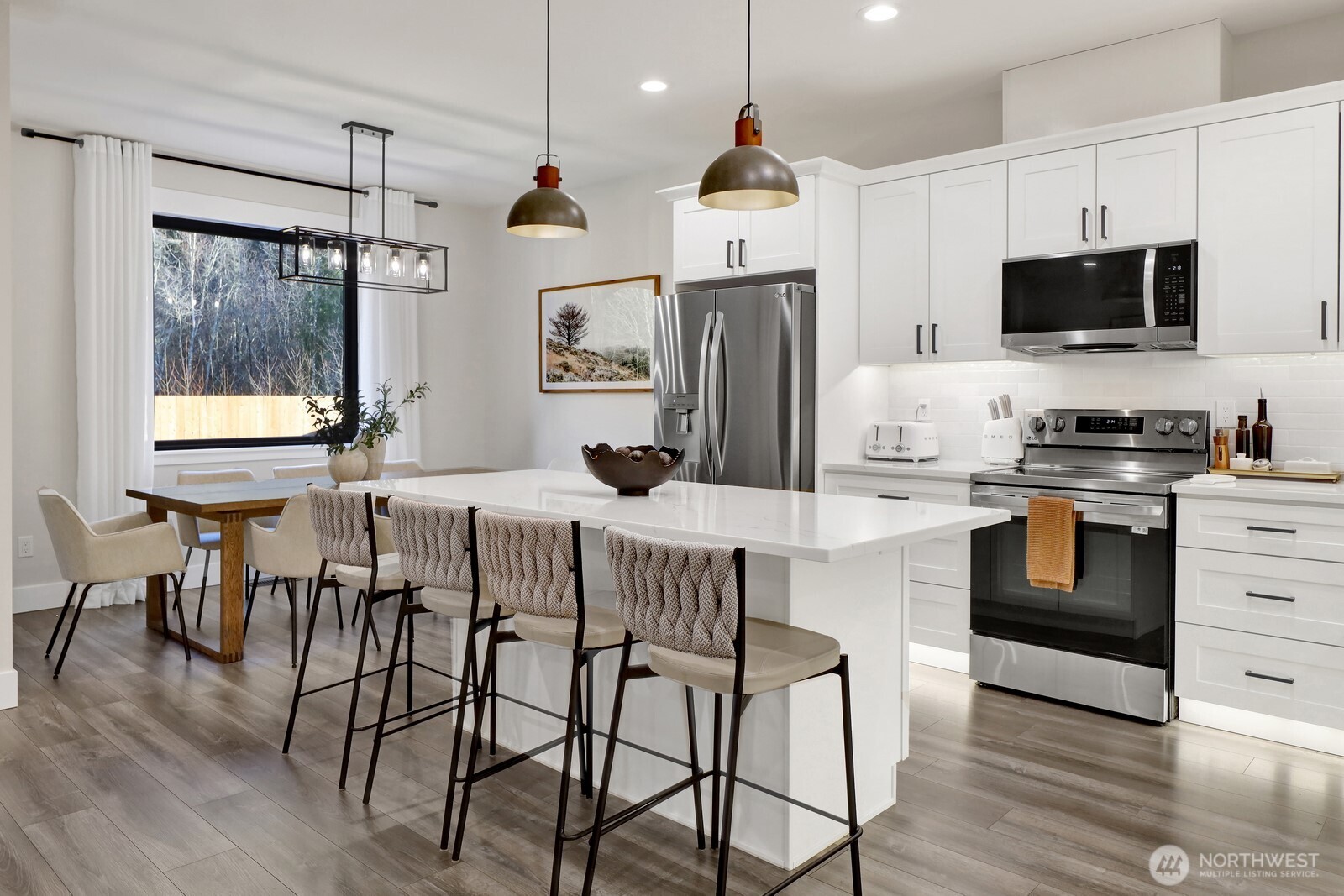 8228 Goldrun Drive Maple Falls, WA 98266 - Photo 19 of 33 a kitchen with stainless steel appliances a stove a sink refrigerator and a microwave