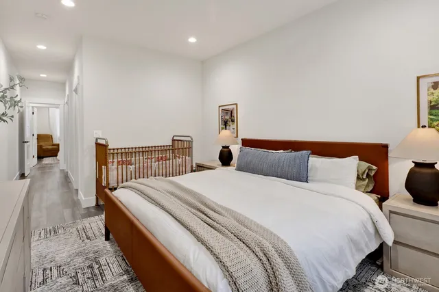 a bedroom with bed and a night stand