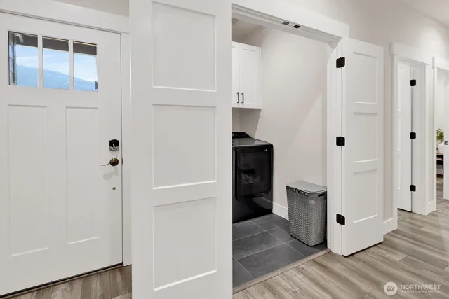 a view of walk in closet with white walls