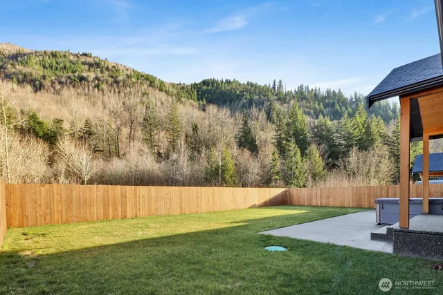 a view of yard with swimming pool and mountain view