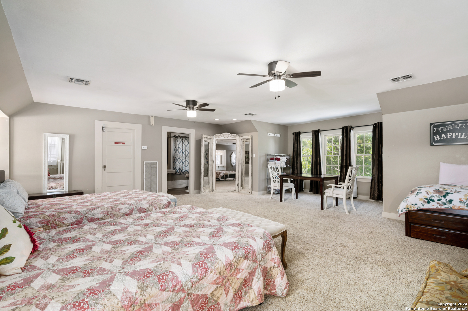 109 Waring Welfare Road Boerne, TX 78006 - Photo 17 of 21 a bedroom with furniture and large windows