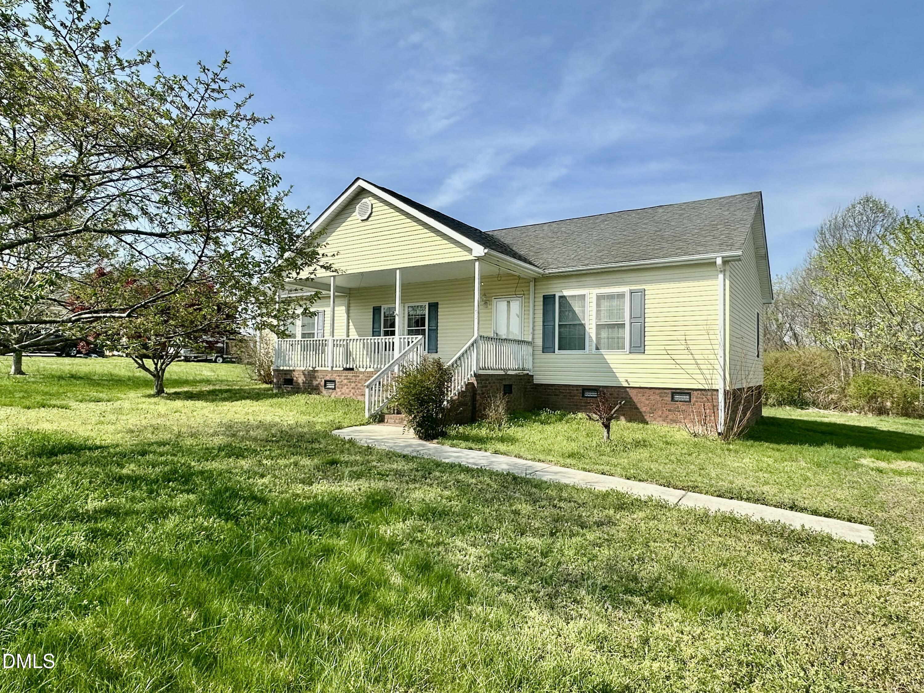 155 Collin Drive Roxboro, NC 27574 - Photo 1 of 20 a front view of house with yard and green space