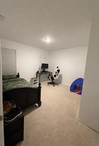 a room with furniture and gym equipment