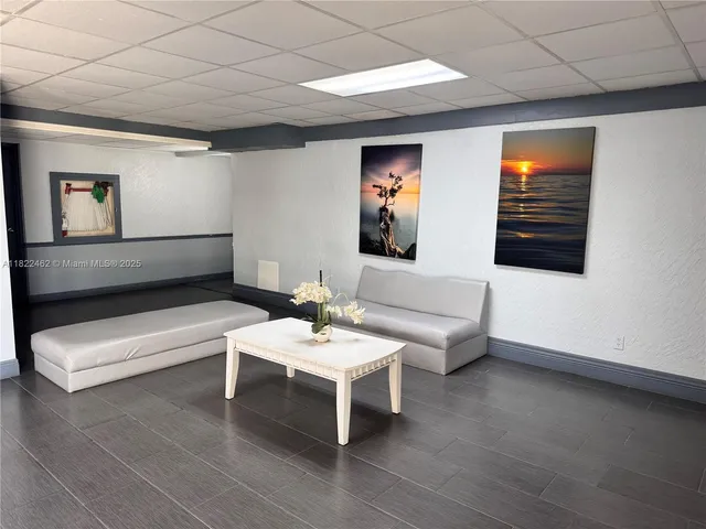 a view of a yard and palm trees