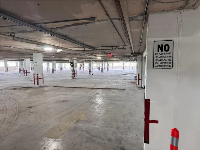 a kitchen with stainless steel appliances granite countertop a refrigerator and a stove