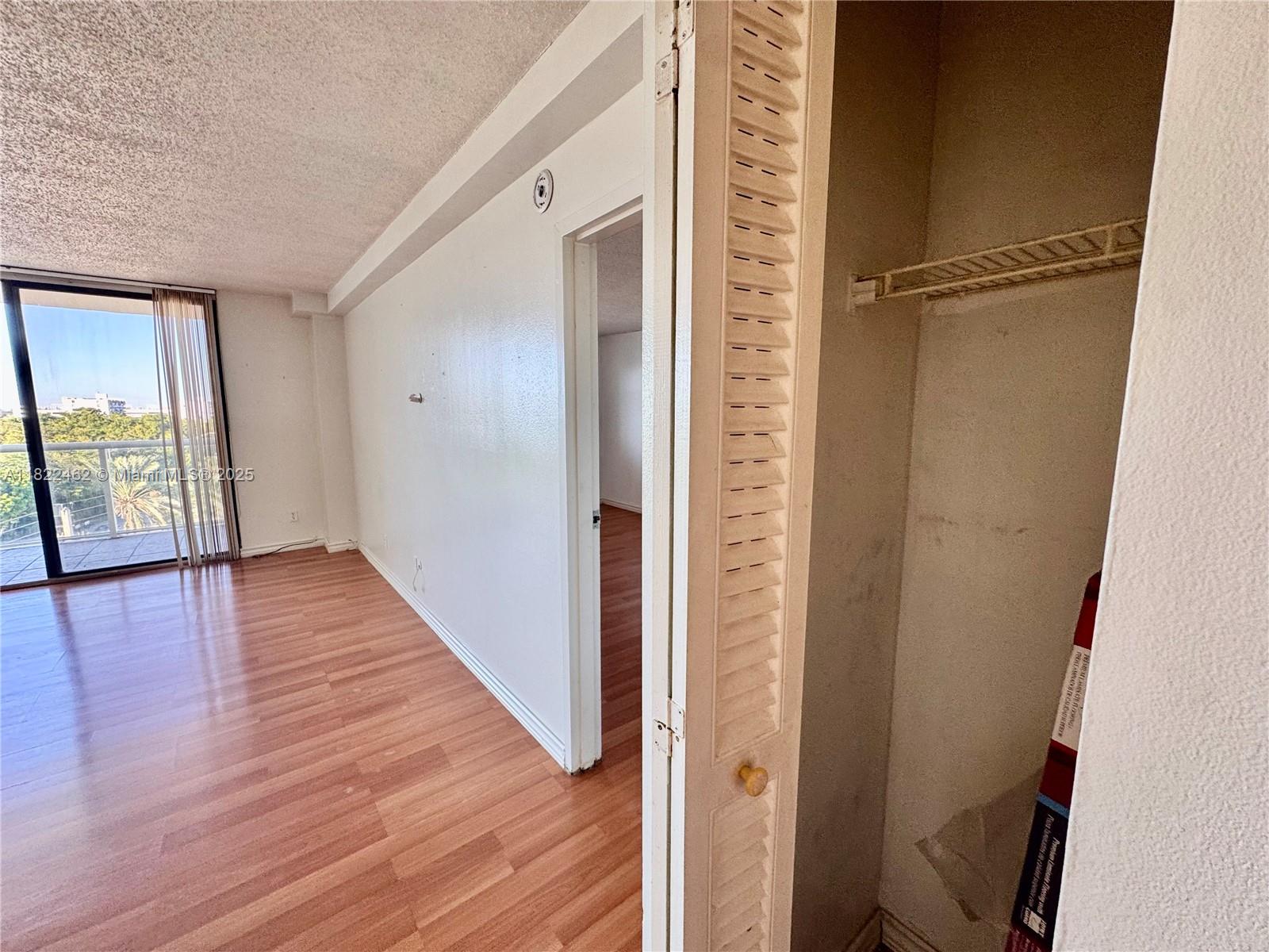 13499 Biscayne Boulevard, Unit 703 North Miami, FL 33181 - Photo 31 of 38 a view of hallway with wooden floor
