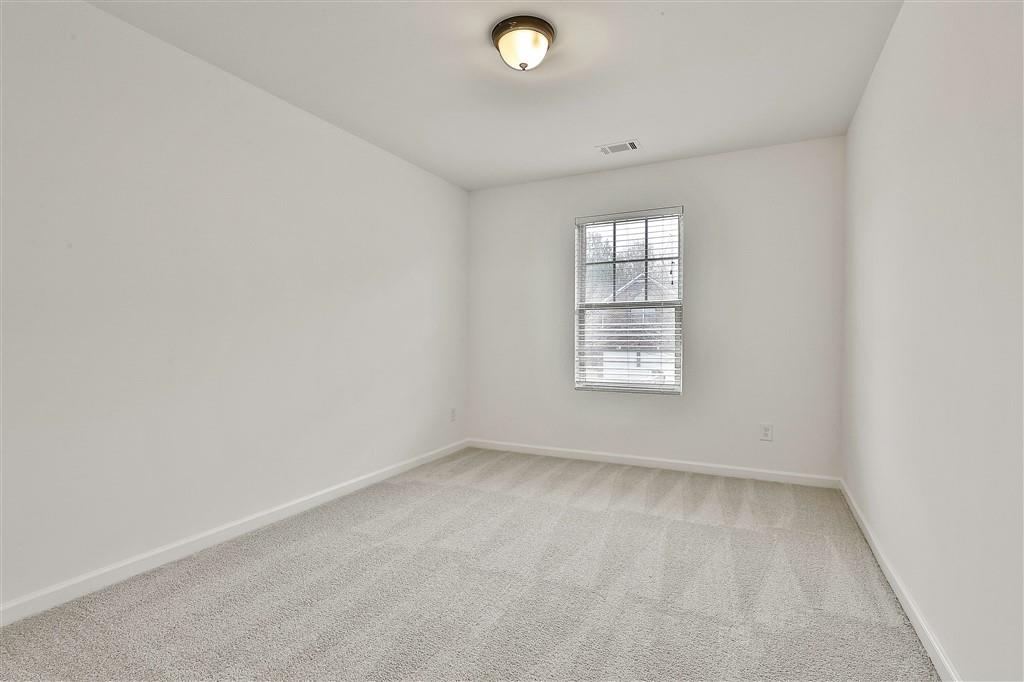 7365 St Peter Way Fairburn, GA 30213 - Photo 17 of 19 an empty room with a window