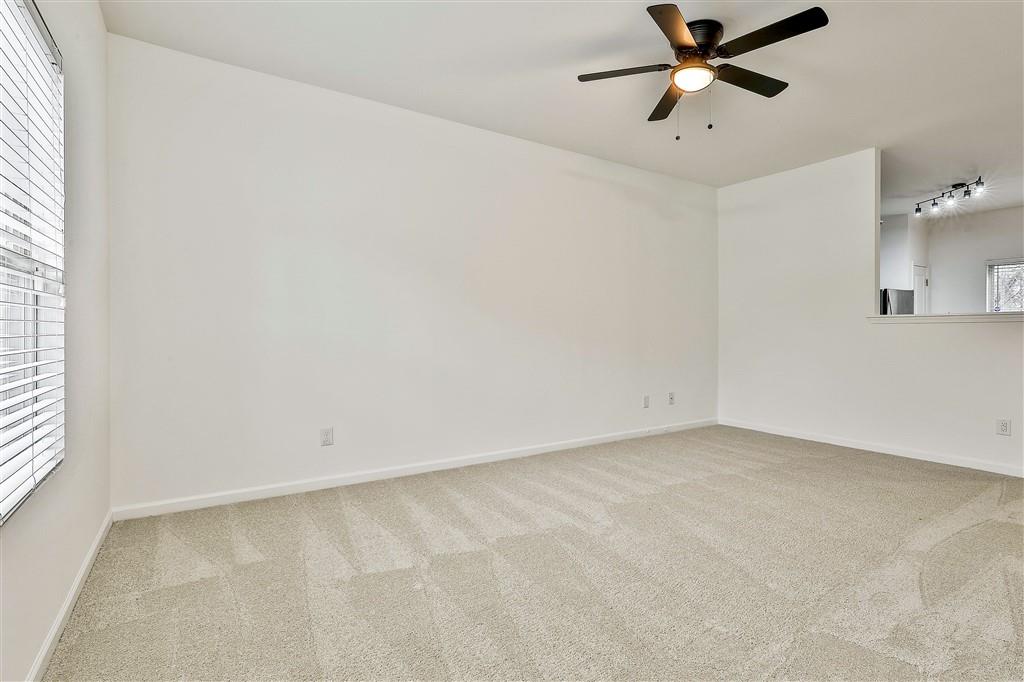 7365 St Peter Way Fairburn, GA 30213 - Photo 4 of 19 an empty room with a window and a fan