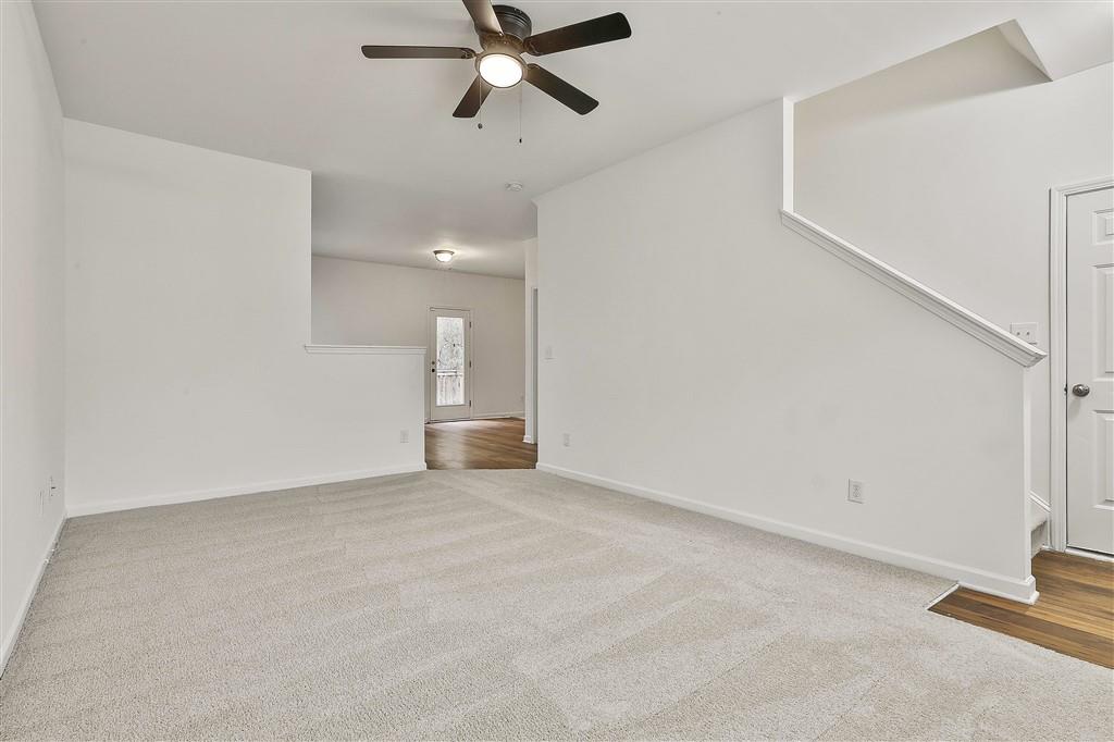7365 St Peter Way Fairburn, GA 30213 - Photo 5 of 19 a view of a room with a ceiling fan and window