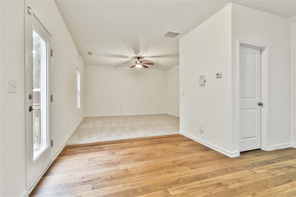 7365 St Peter Way Fairburn, GA 30213 - Photo 8 of 19 a view of a room with wooden floor