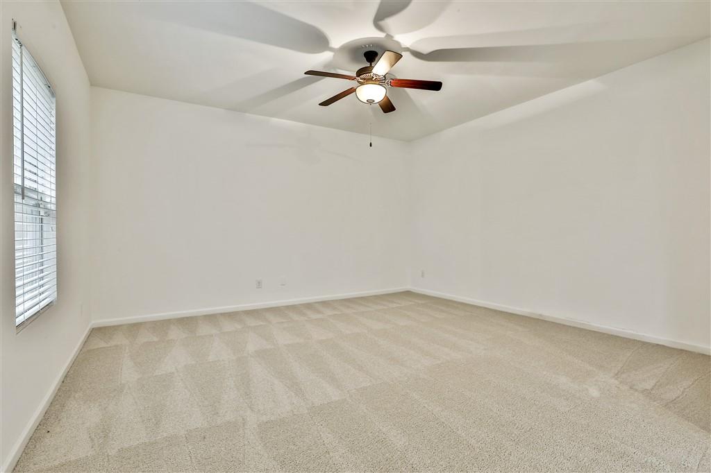 7365 St Peter Way Fairburn, GA 30213 - Photo 10 of 19 an empty room with a window and a fan