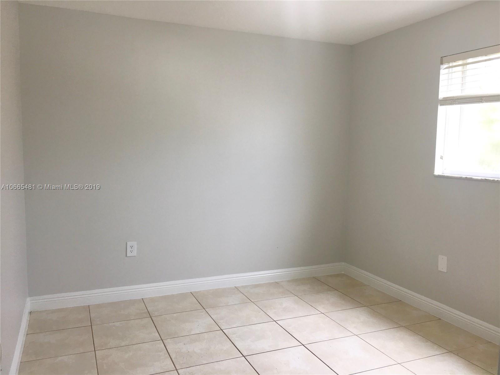1453 Southwest 3rd Street, Unit 305 Miami, FL 33135 - Photo 11 of 12 a view of an empty room and window