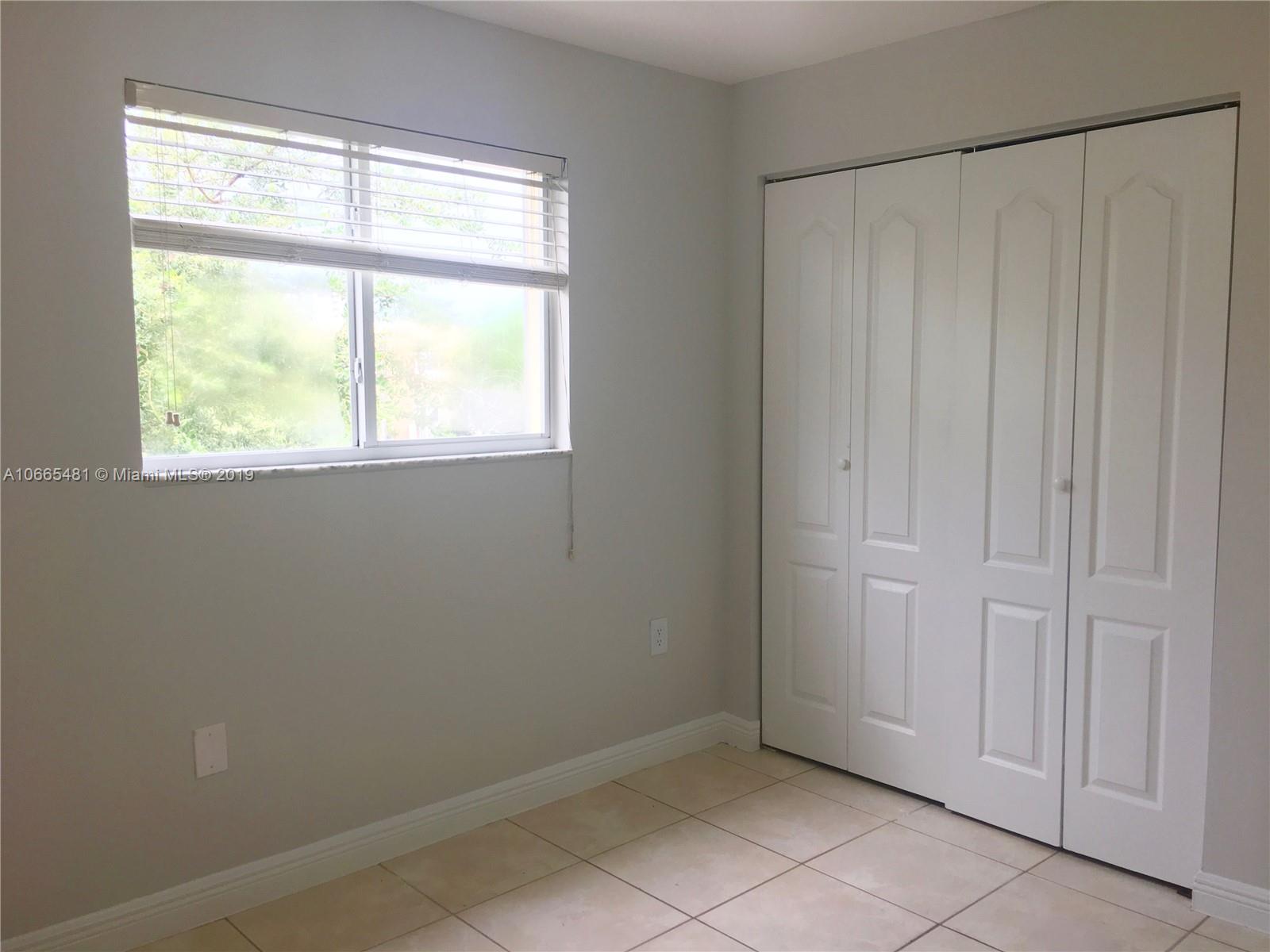 1453 Southwest 3rd Street, Unit 305 Miami, FL 33135 - Photo 12 of 12 an empty room with a window