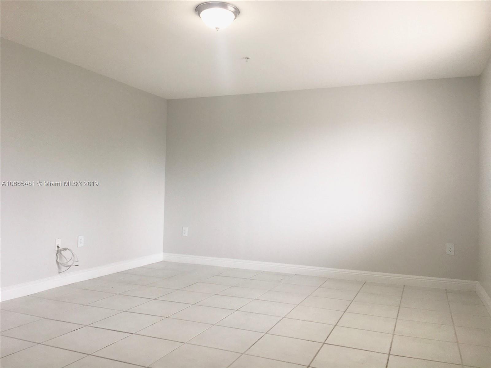 1453 Southwest 3rd Street, Unit 305 Miami, FL 33135 - Photo 3 of 12 a view of an empty room