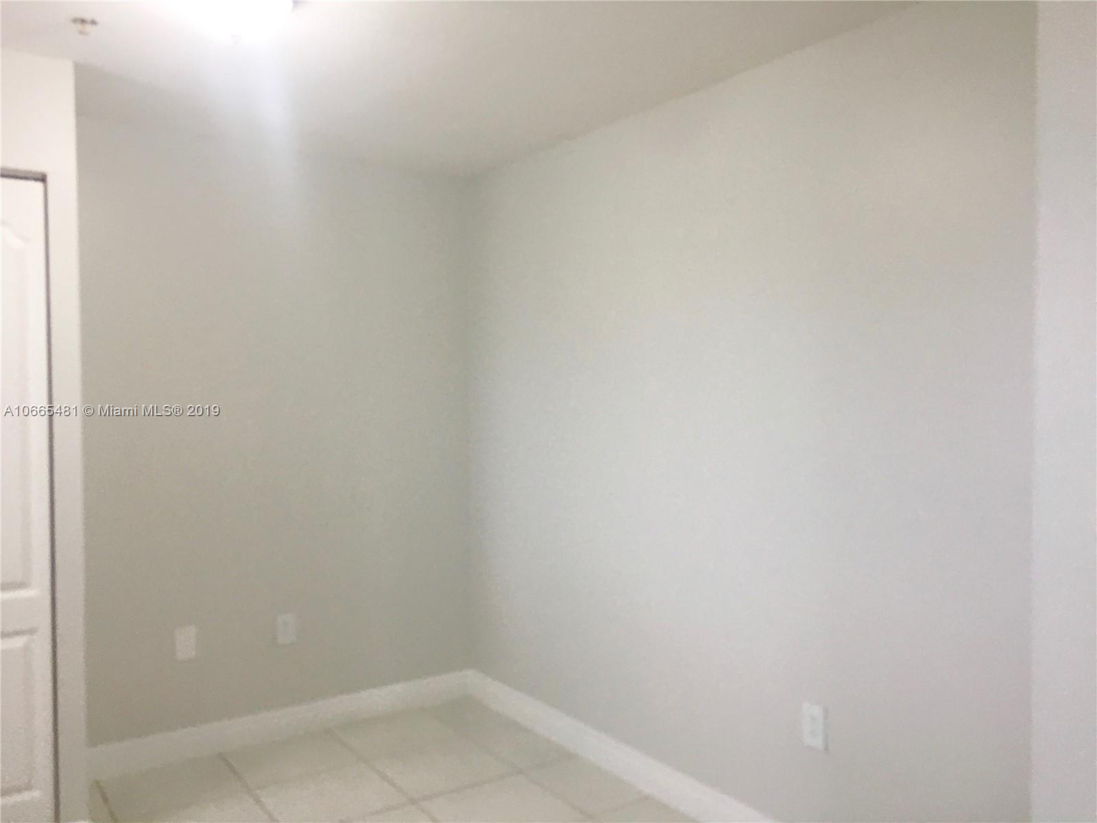 1453 Southwest 3rd Street, Unit 305 Miami, FL 33135 - Photo 5 of 12 a small space with a window