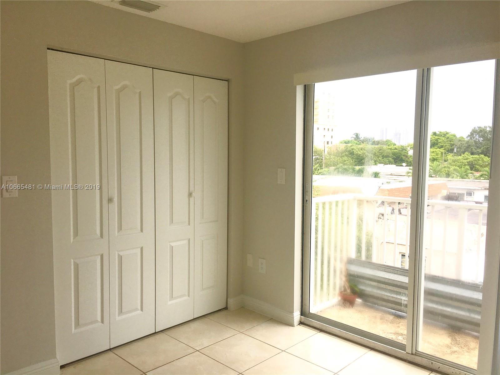 1453 Southwest 3rd Street, Unit 305 Miami, FL 33135 - Photo 7 of 12 a view of a bathroom with a glass door
