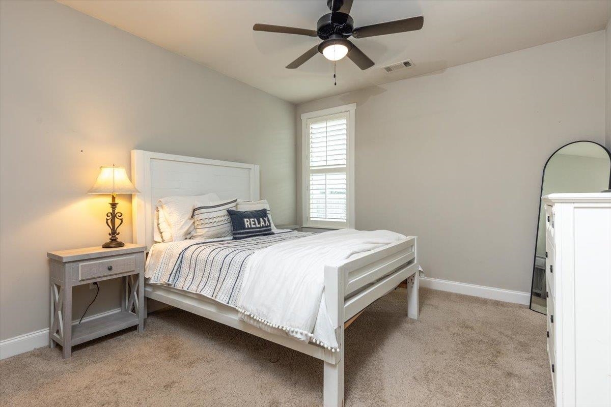 608 Cypress Run Cove Collierville, TN 38017 - Photo 21 of 40 Bedroom with light carpet and ceiling fan