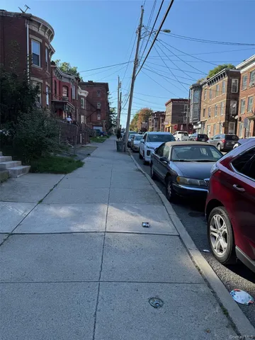 a view of street with parked cars