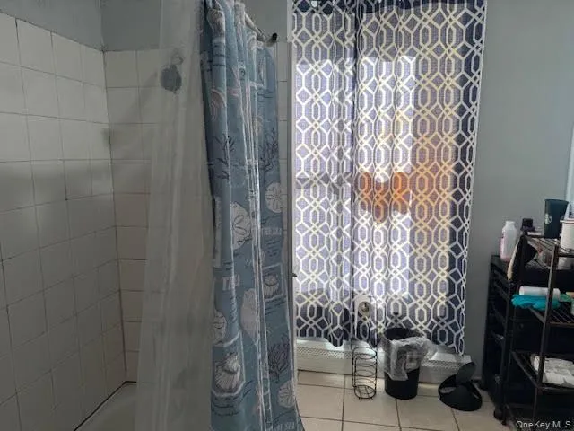 a living room with furniture and a flat screen tv with wooden floor