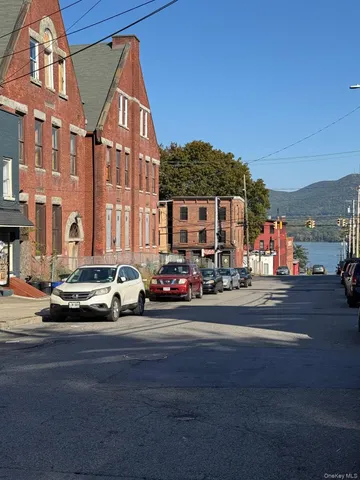 a city street lined with buildings and cars