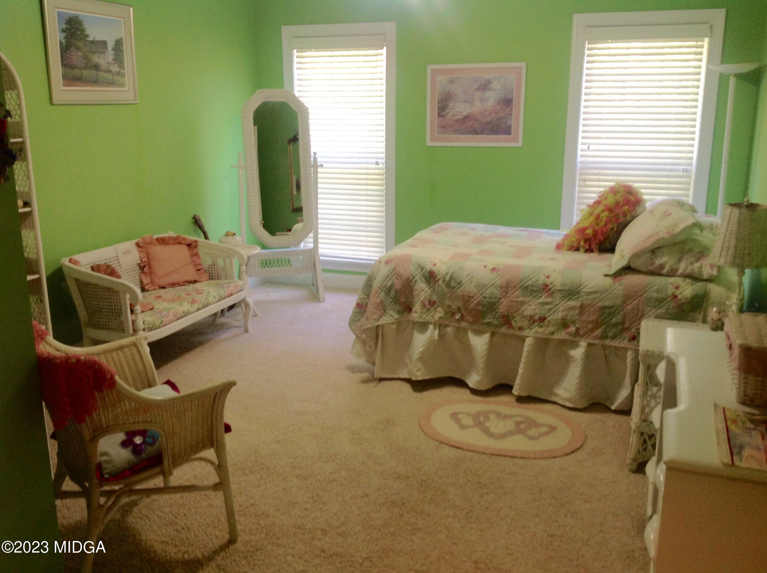 629 Pate Road Juliette, GA 31046 - Photo 49 of 118 a bedroom with a bed and chair