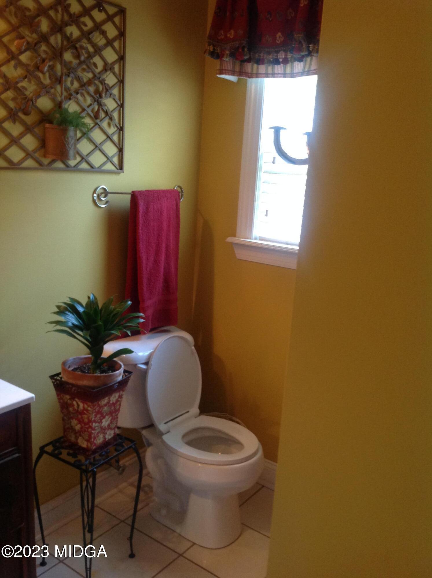 629 Pate Road Juliette, GA 31046 - Photo 54 of 118 a bathroom with a toilet and a chair