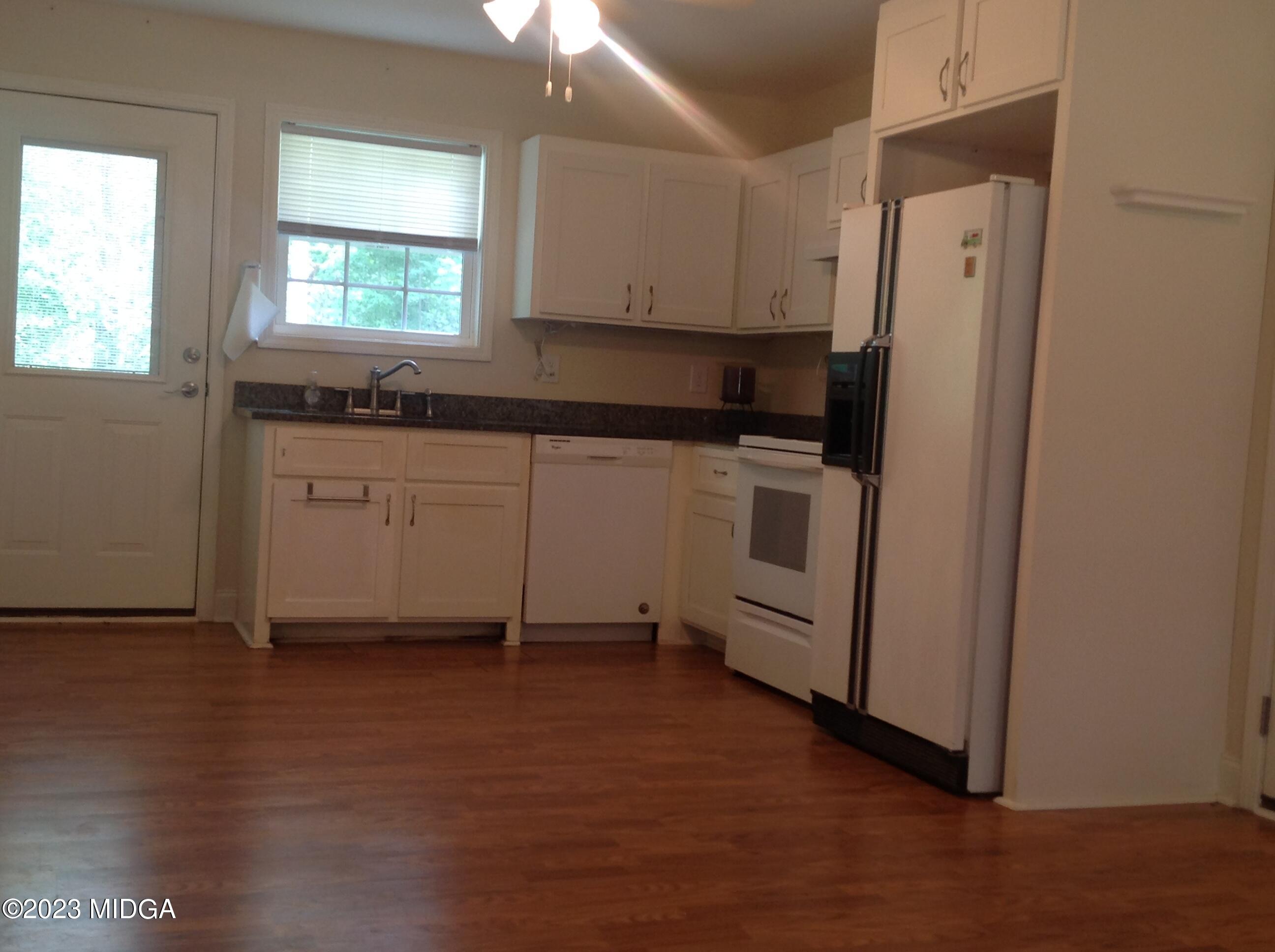 629 Pate Road Juliette, GA 31046 - Photo 88 of 118 a kitchen with stainless steel appliances a refrigerator sink and cabinets