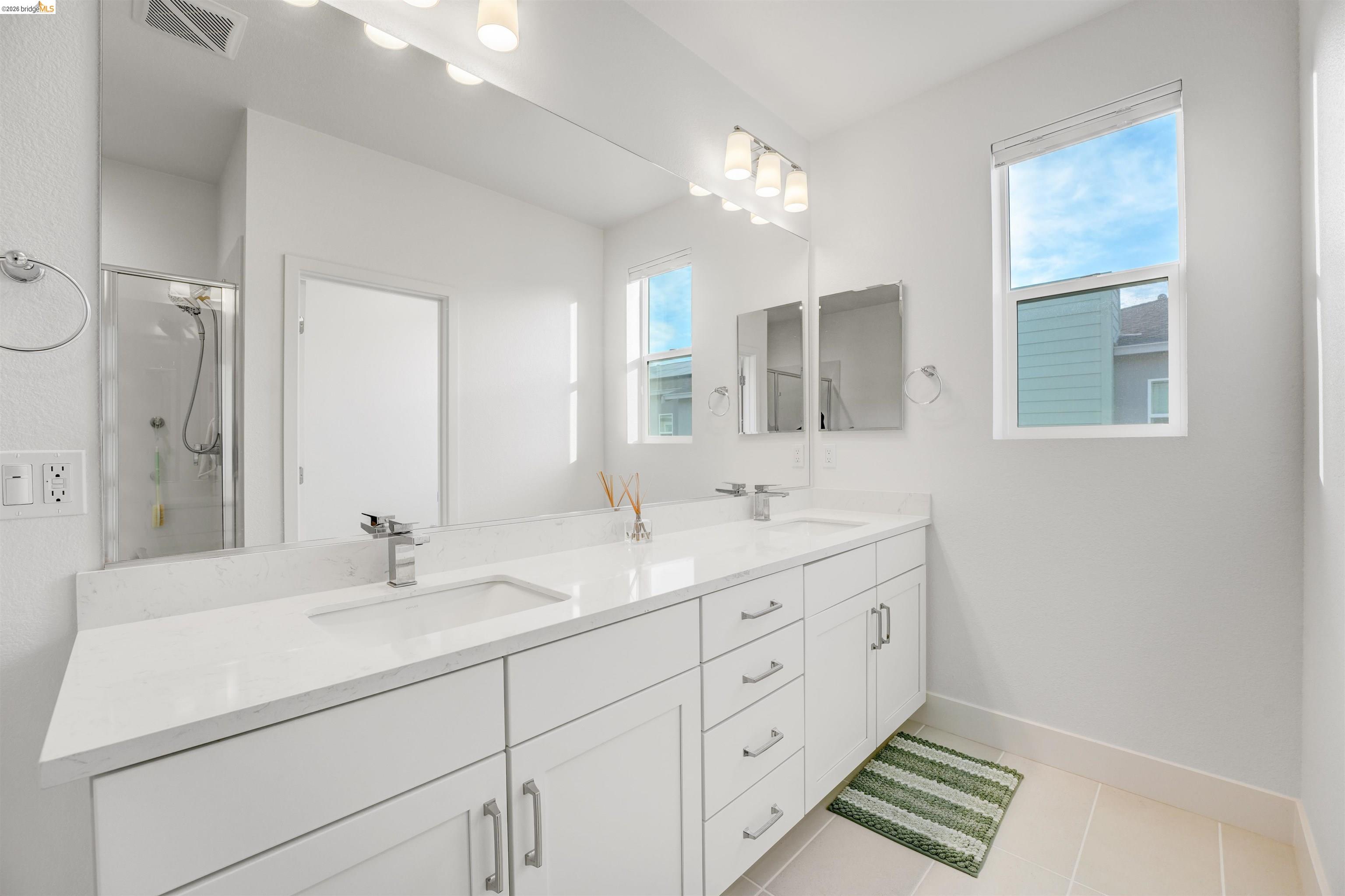 7101 Melon Court San Ramon, CA 94583 - Photo 47 of 58 a bathroom with double sink and a mirror